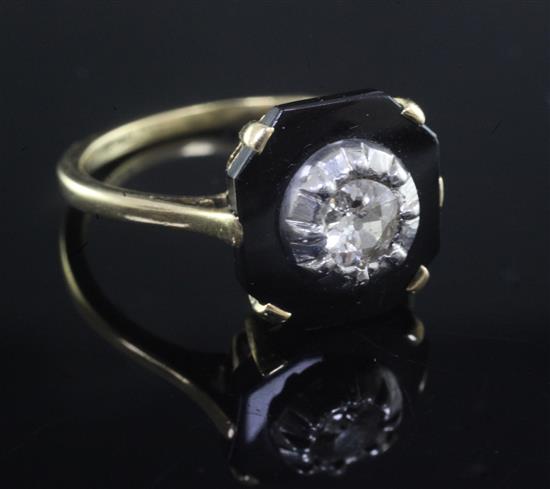 An 18ct gold, black onyx and diamond set octagonal tablet ring, size Q.